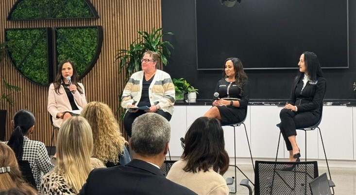 Four panelists speaking at an OC event