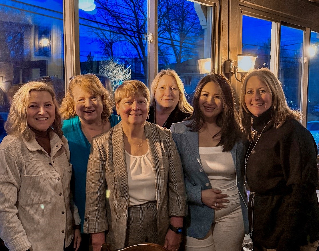 A group of women posing for a photo</p>
<p>AI-generated content may be incorrect.